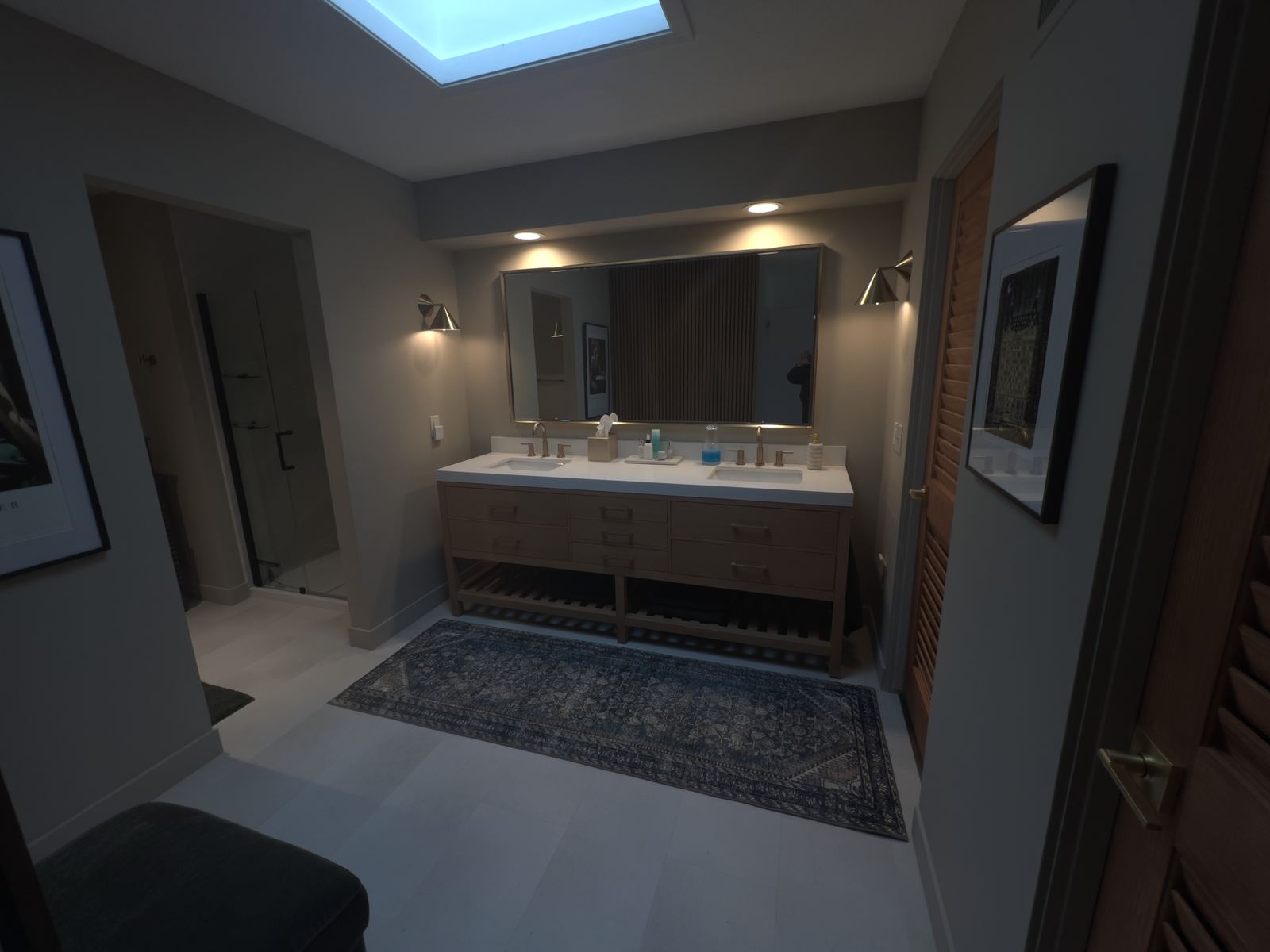 Finished primary bath vanity with skylight, oak base, brass sconces and slat wall