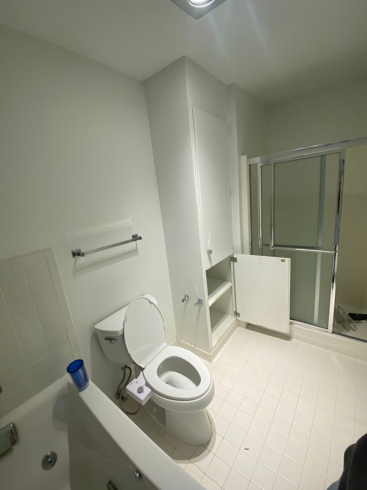 Original full bathroom with white tile floor and dated fixtures