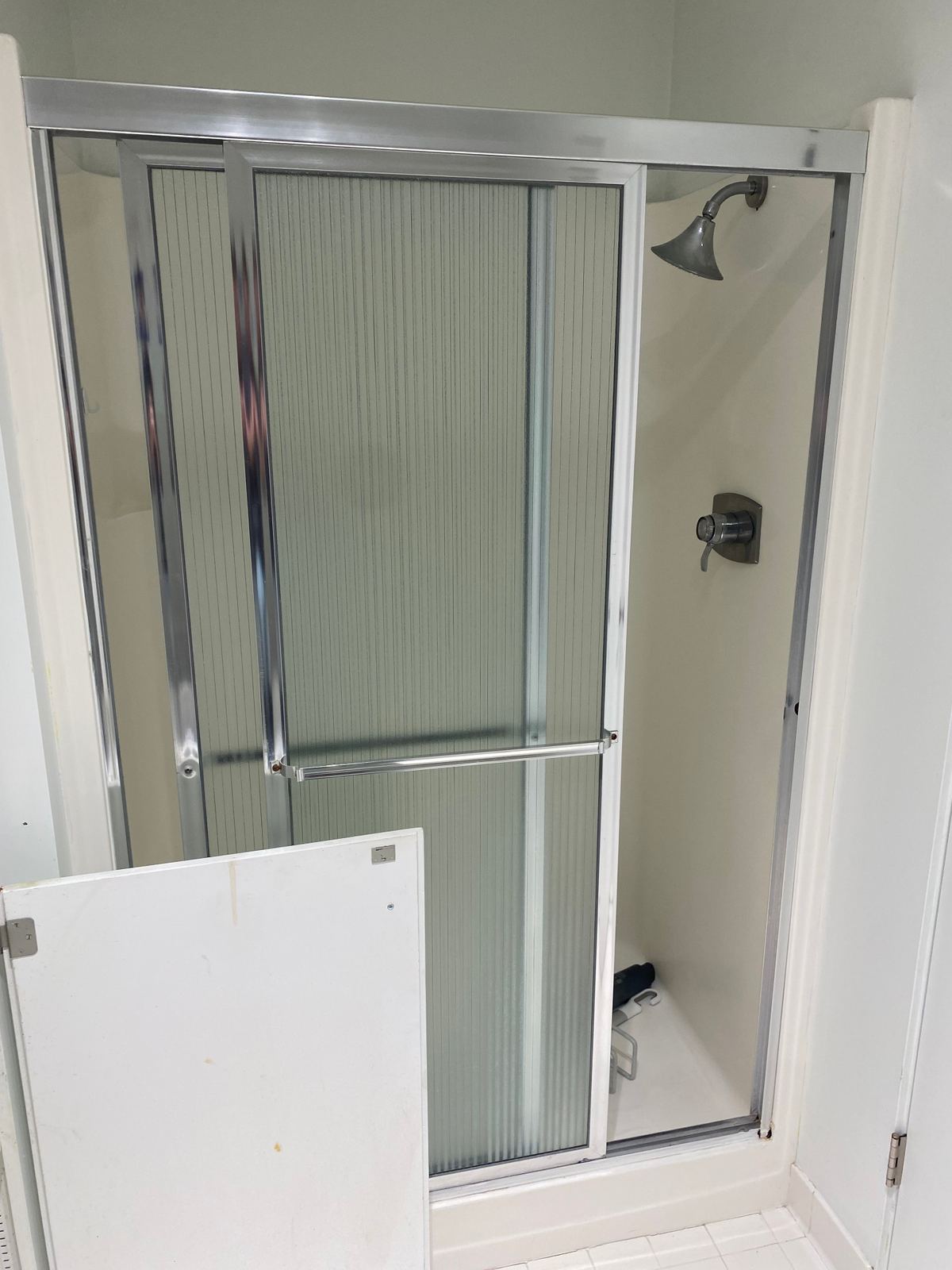 Original bathroom with dated vanity and fixtures before renovation
